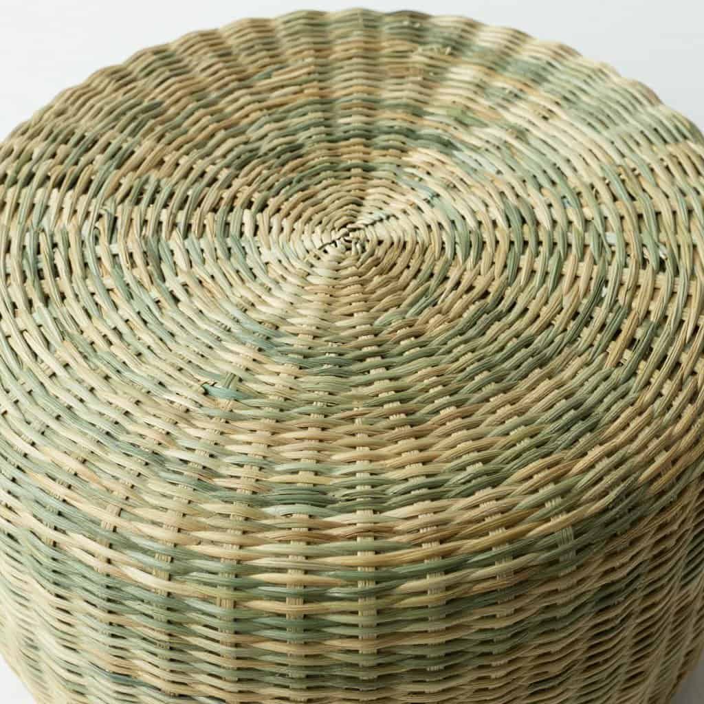 Seagrass wicker ottoman showing the material's unique texture